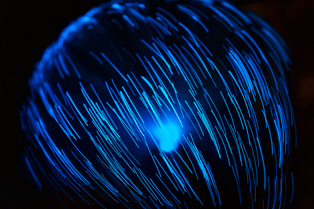 Blue abstract particles and lines in dark background